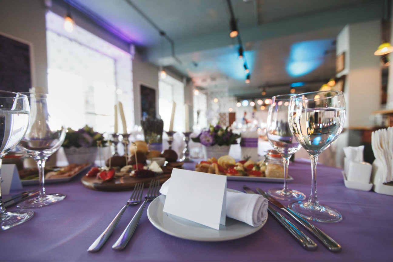 A table with food and glasses on it

AI-generated content may be incorrect.