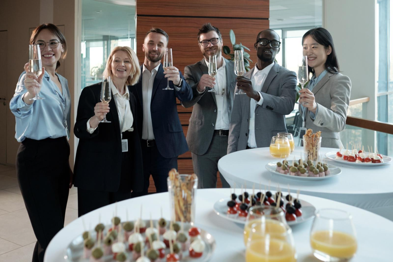 A group of people holding champagne glasses

AI-generated content may be incorrect.
